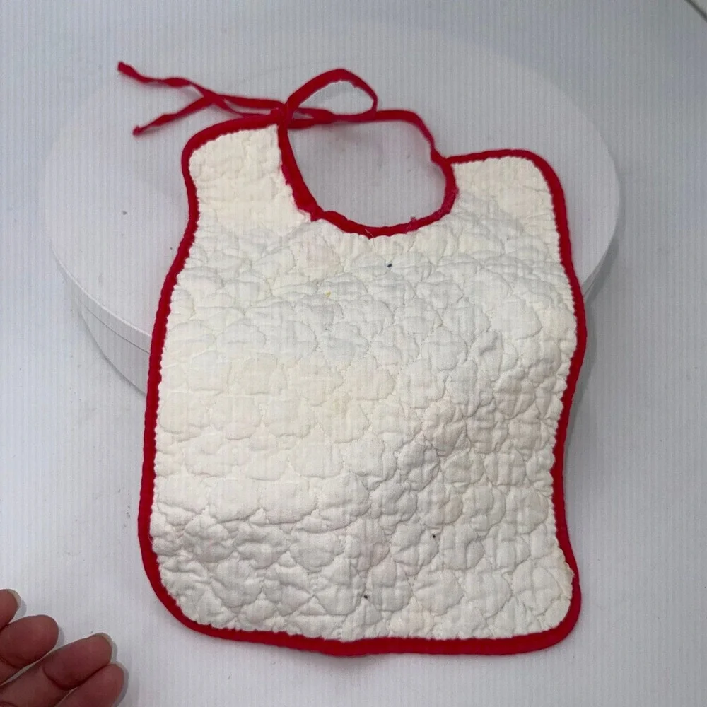Vtg handmade quilted baby bib embroidered girl in a hat sitting on a fence